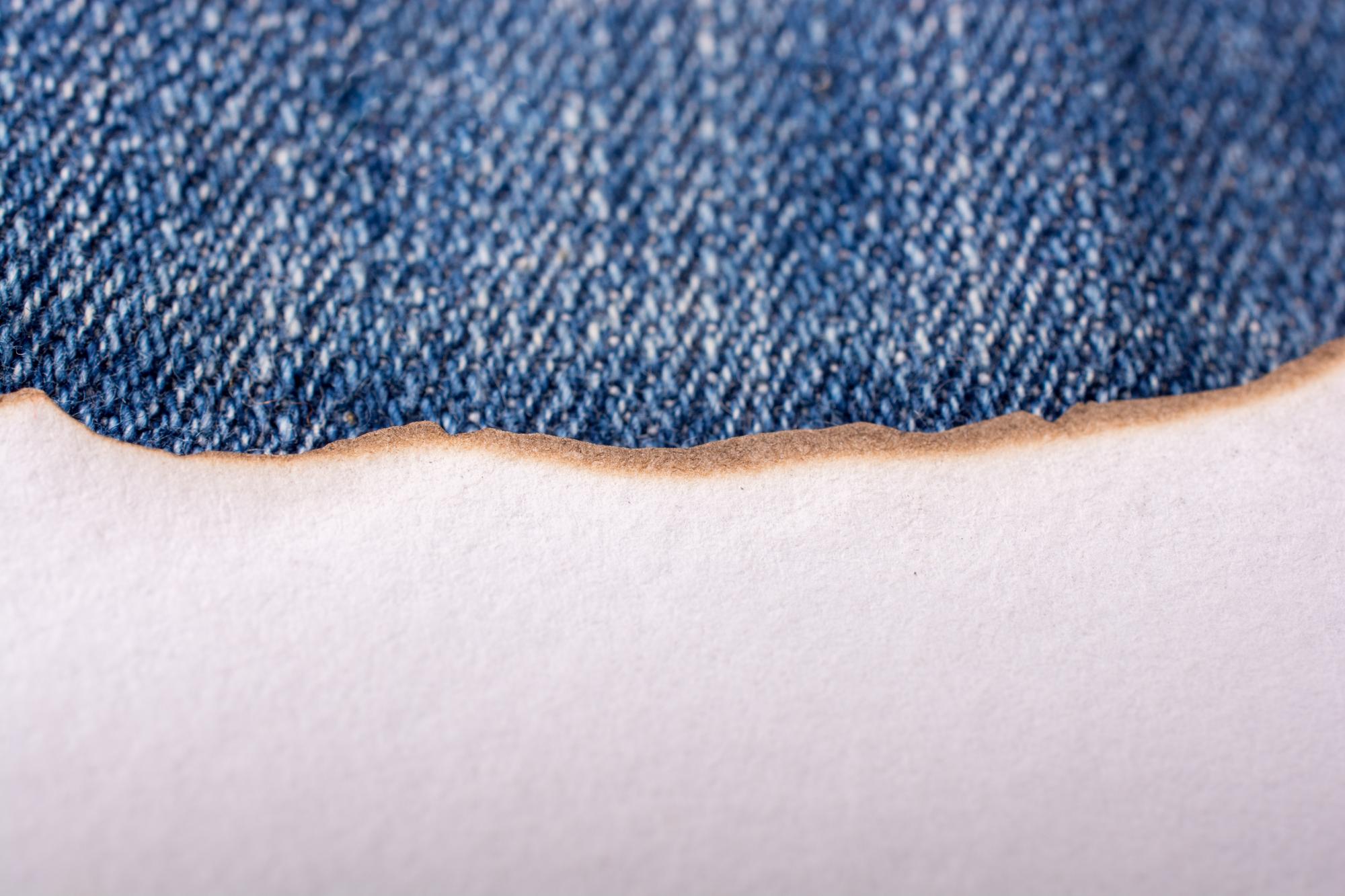 Close-up of dense satin stitch on denim